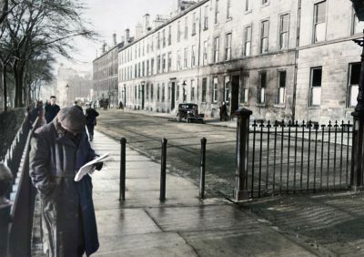 A Man reads a Newspaper on Monteith Row, Glasgow, April 1939
