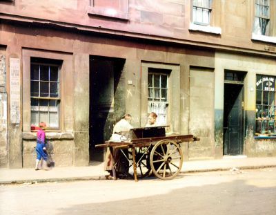 A Woman selling Fish from a Barrow in Tobago Street in Calton in the early 1900s
