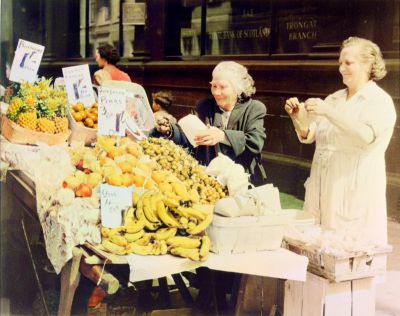 A fruit barrow outside the Royal Bank of Scotland in the Trongate, taken by J R Murray in 1955
