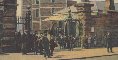 A gathering at the main gate of the Maryhill Barracks Glasgow on Maryhill Road Early 1900s
