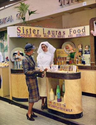A woman talks to a shop assistant at the Sister Lauras Food Supplement stand at the Empire Exhibition, Glasgow, UK, circa May 1938
