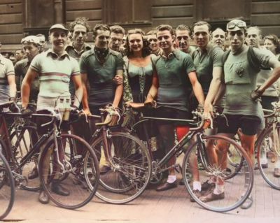 British film star Jean Kent surrounded by a group of cyclists at Mansion House, London, before they set off on the second lap of the Five Day Cycle Race to Glasgow 7th August 1945
