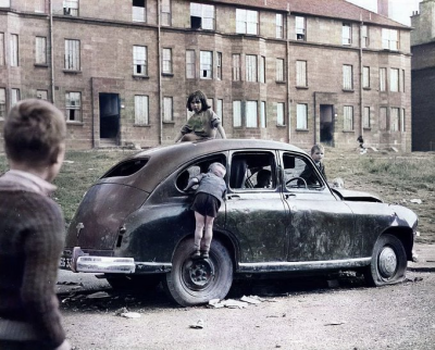 Children play in an abandoned Car in the Blackhill area of Glasgow, January 1969
