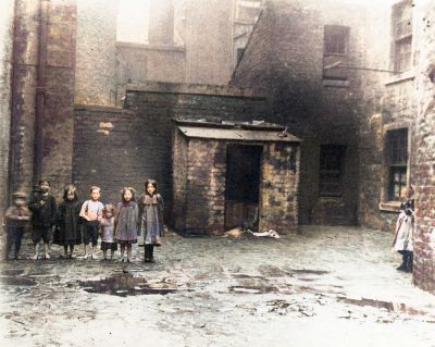Colourised Photo Of Kids Posing For A Photograph In The backcourt At 76 Crown Street Gorbals in 1912
