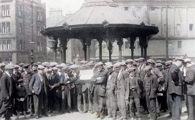 Men gathered at Bridgeton Cross Glasgow 1930
