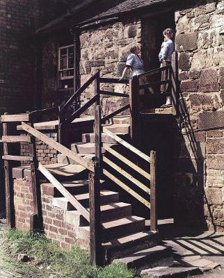 Stairhead gossip at the ex Weaving Sheds near Parkhead Cross, Glasgow 1955
