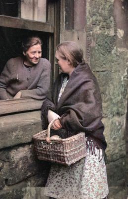 Two women chatting through an open window in the Gorbals area of Glasgow 31st January 1948
