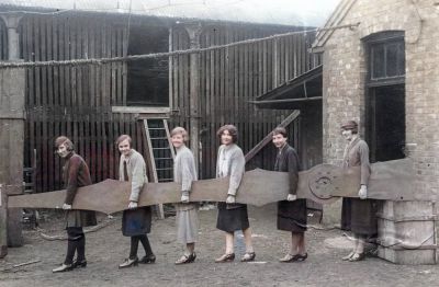 Women holding the minute hand from the Singer Clock Tower Clydebank Part of the Greater Glasgow extended area 1926
