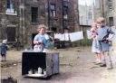 Colourised_Photo_Children_happily_playing_in_the_back_courts_of_a_Glasgow_Tenement_1960s.jpg